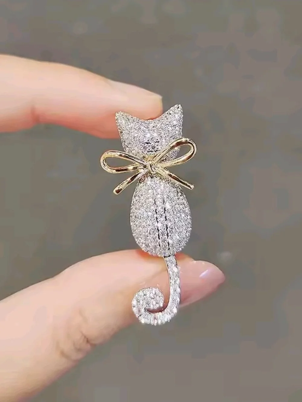 Sparkling Silver Cat Brooch with Gold Bow